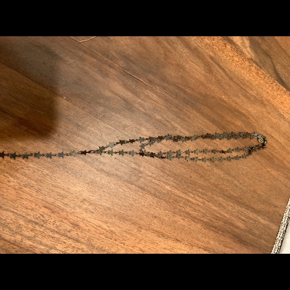 Raw and rebellious black star layered necklace